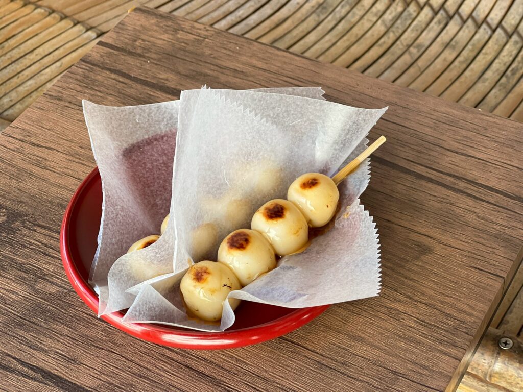 Mitarashi dango served at a local sweets shop in Kojima during a town walk or cycling tour.